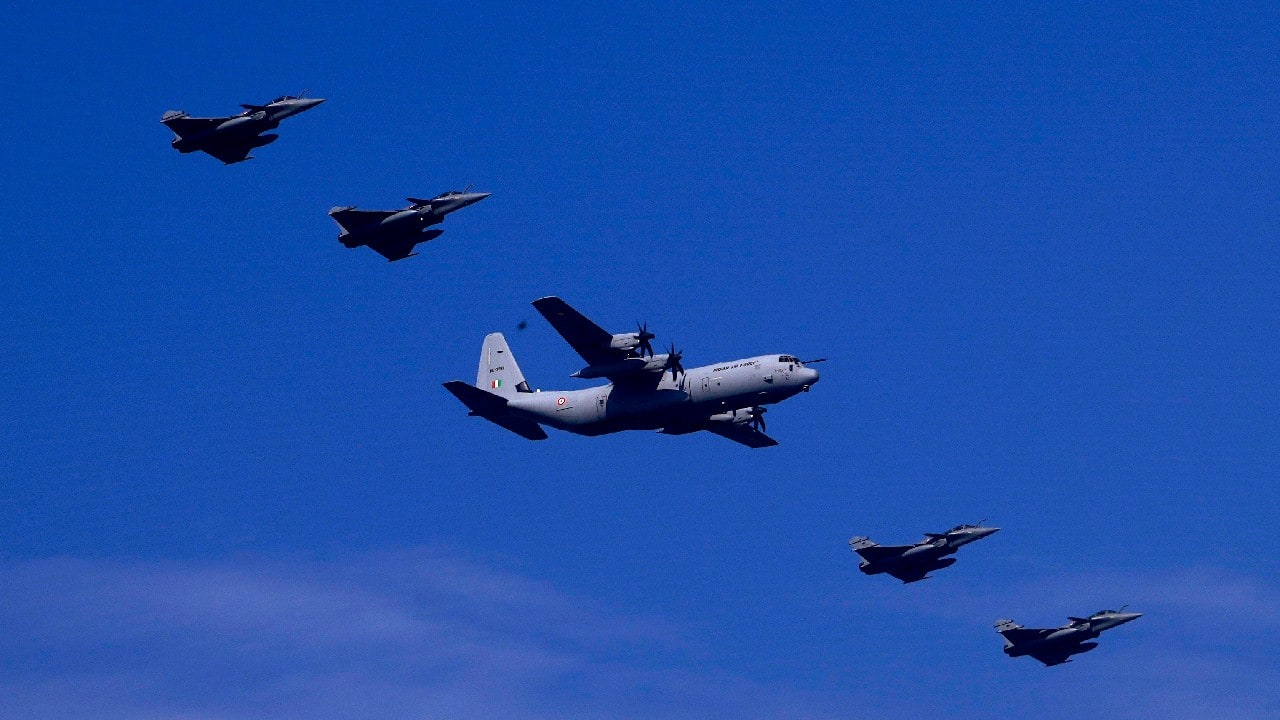 Indian Air Force C 130 Hercules, center, flies in a formation with four Rafale fighter aircrafts during Republic Day parade rehearsals, in New Delhi. (Image: AP)