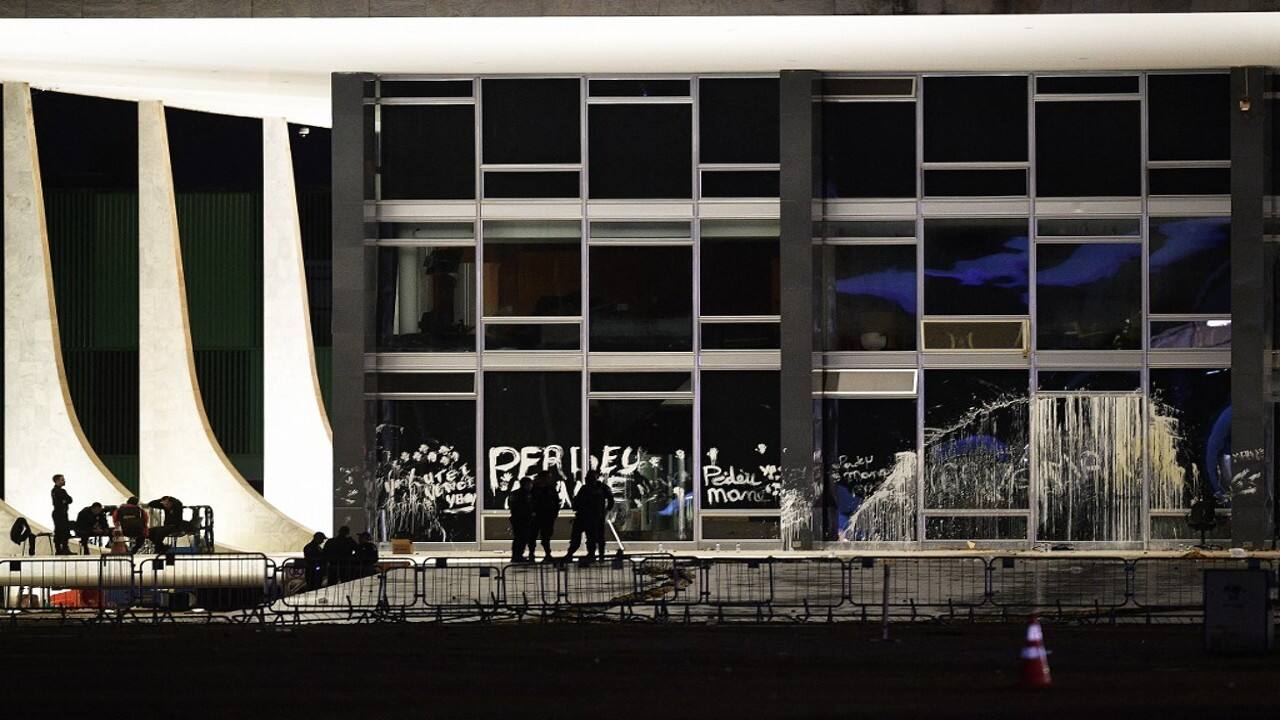 Paint and graffiti damage caused at the Supreme Court by supporters of former Brazilian President Jair Bolsonaro, in Brasilia. Brazilian security forces locked down the area around Congress, the presidential palace and the Supreme Court on January 9, a day after supporters of ex-president Jair Bolsonaro stormed the seat of power in riots that triggered an international outcry. (Image: AFP)