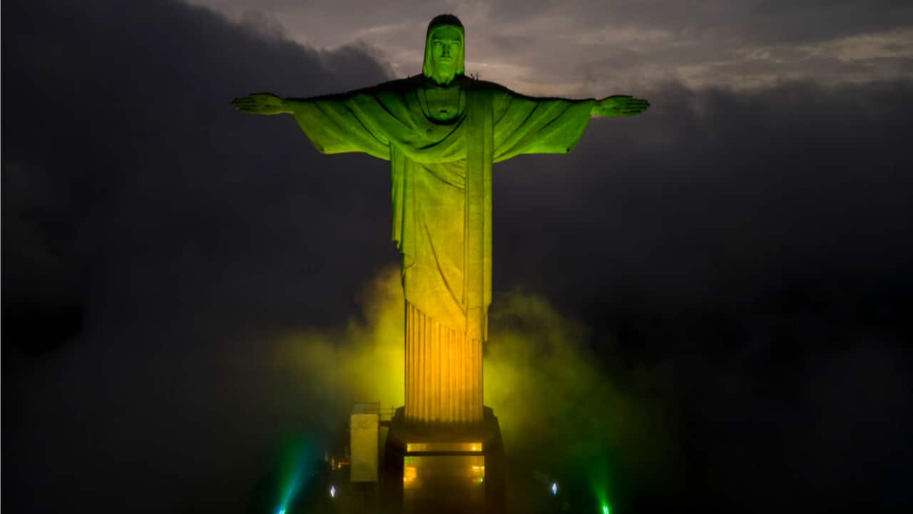 Christ the Redeemer statue is illuminated in the colors of the Brazilian national flag to honor late soccer legend Pele, in Rio de Janeiro, Brazil.