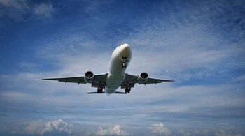 A commercial airplane approaching the runway for landing
