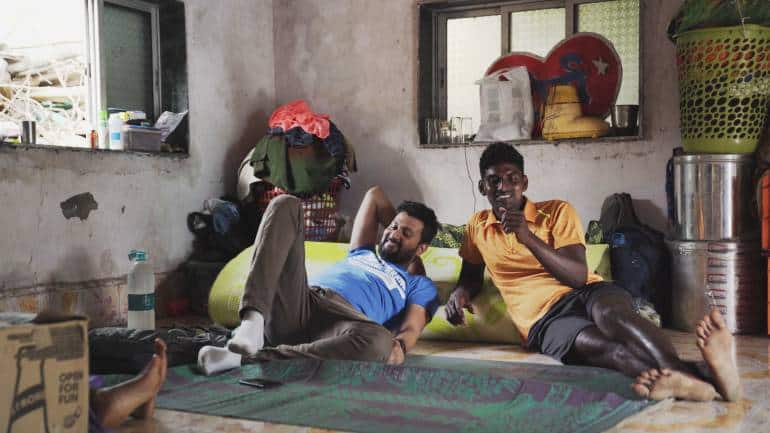 Ganesh Nakhawa (left) relaxes with his best friend Rakesh Koli (right) in a still from 'Against the Tide', directed by Sarvnik Kaur. (Image courtesy of Snooker Club Films)