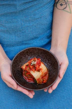 Kimchi is made by lacto-fermentation, the same process that creates sauerkraut and traditional pickles. (Photo via Unsplash)