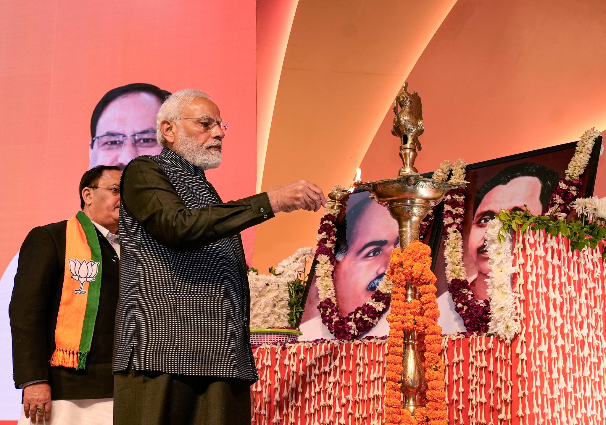 Prime Minister Narendra Modi pays tribute to Syama Prasad Mukherjee and Deendayal Upadhyaya during the BJP National Executive meeting, at NDMC Convention Centre in New Delhi, Monday, Jan. 16, 2023.