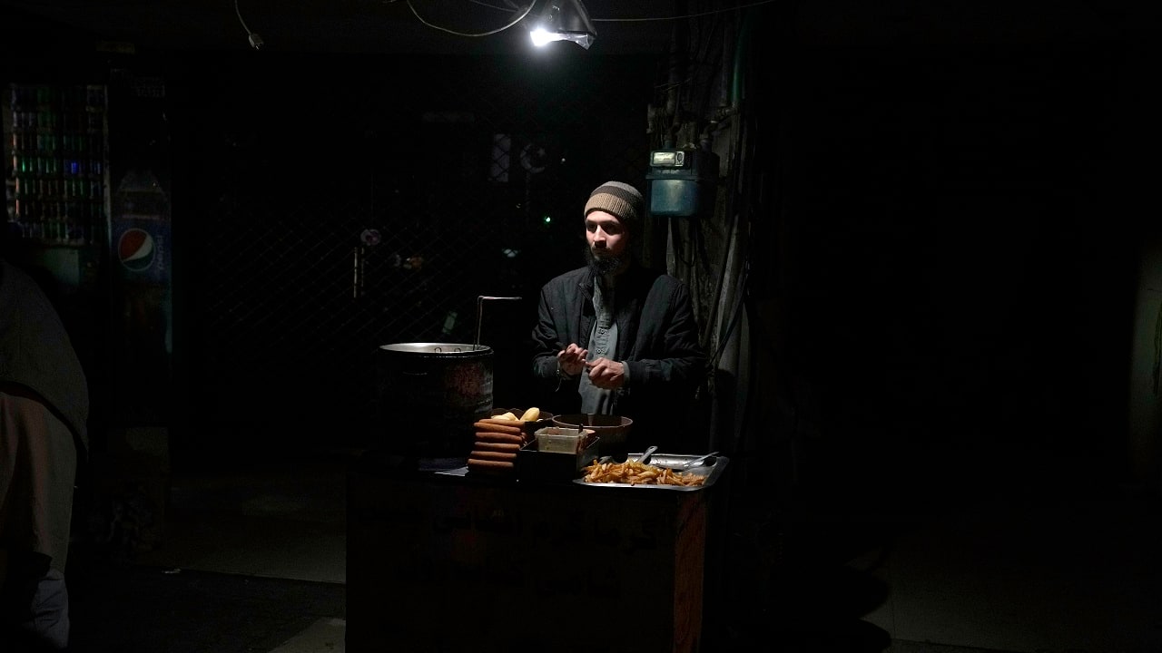 Much of Pakistan was left without power on Jan 23 as an energy-saving measure by the government backfired. The outage spread panic and raised questions about the cash-strapped government's handling of the country's economic crisis. (AP Photo)