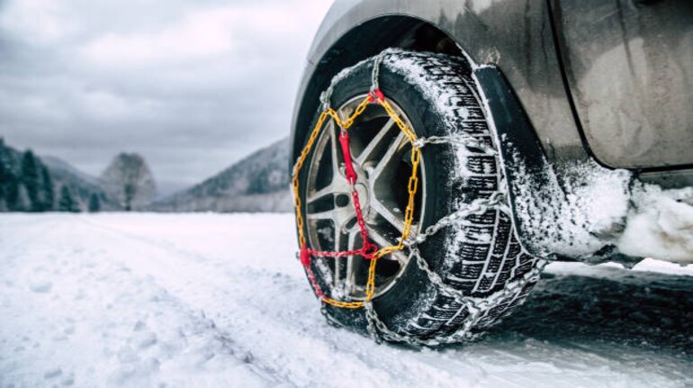 https://images.moneycontrol.com/static-mcnews/2023/01/snow-chains-on-tire-at-winter-road.png?impolicy=website&width=770&height=431