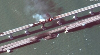 October 8, 2022: 'miracle' bridge bombed | Russia's prestige takes a severe battering on October 8 when Putin's much-vaunted "miracle" bridge linking the Russian mainland to the occupied Crimea peninsula across the Kerch Strait is partly blown up. Ukrainian social media lights up in rejoicing at the sight of black smoke and flames billowing from a despised symbol of Russia's annexation of Crimea. Kyiv denies being behind the attack. This picture was taken by an amateur photographer in the Crimean city of Kerch, who asked to remain anonymous. (Source: AFP)