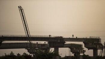 Workers construct an overbridge outside the Deendayal Port Authority in Kandla, India, on Thursday, Sept. 8, 2022. India is scheduled to announce its CPI figures on Sept. 12. Photographer: Prashanth Vishwanathan/Bloomberg