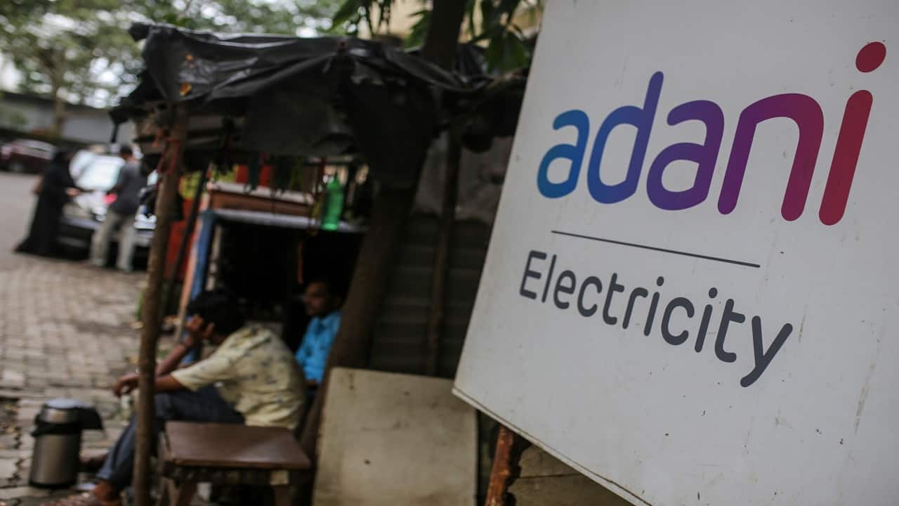 Most Adani dollar bonds exit distressed levels on debt promises