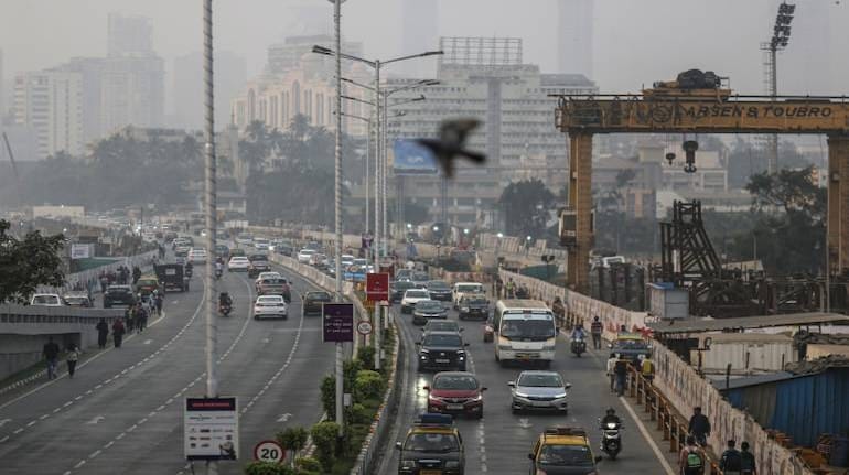 Vehicles travel along a road in Mumbai, India, on Saturday, Jan. 7, 2023. India is scheduled to release consumer price index (CPI) figures on Jan. 12. Photographer: Dhiraj Singh/Bloomberg