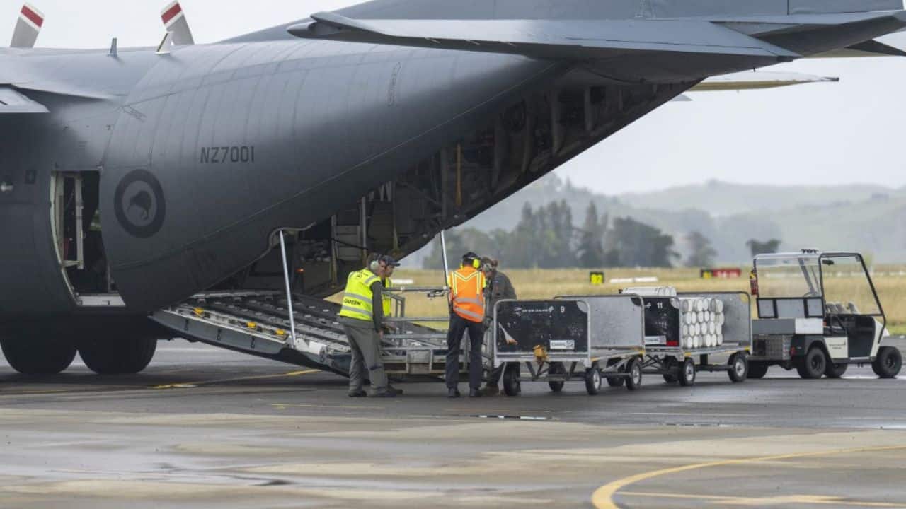 The New Zealand Defence Force has deployed two large naval vessels and a C-130 Hercules transport plane to deliver thousands of litres of water along with personnel and several mobile water treatment plants to hard-hit regions. (Source: AFP) The New Zealand Defence Force has deployed two large naval vessels and a C-130 Hercules transport plane to deliver thousands of litres of water along with personnel and several mobile water treatment plants to hard-hit regions. (Source: AFP)