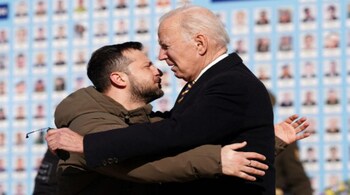 US President Joe Biden (R) is greeted by Ukrainian President Volodymyr Zelensky (L) during a visit in Kyiv on February 20, 2023. (AFP)