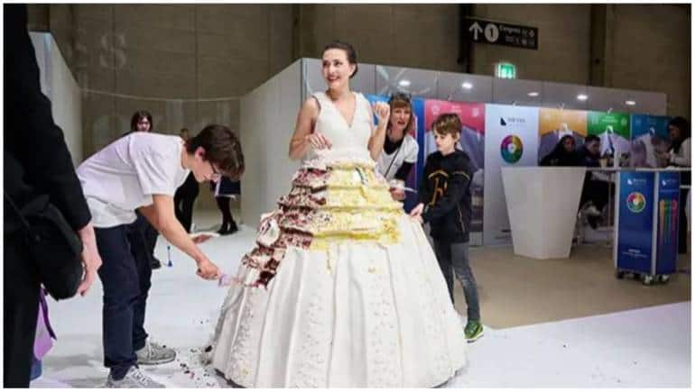 I had a crazy idea' - Swiss baker makes 131.15kg wearable cake dress, sets Guinness  world record | Life