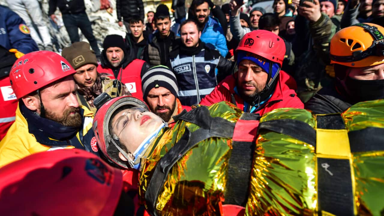 Rescuers carry Zeynep Polat, pulled out from a collapsed building days after the earthquake, in Kahramanmaras, southern Turkey, Thursday.