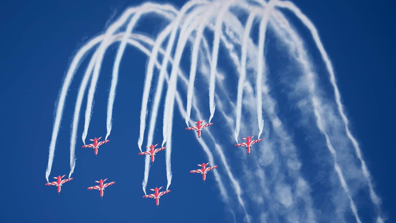 Indian Air Force's aerobatic team Suryakiran perform maneuvers on the first day of the Aero India 2023 at Yelahanka air base in Bengaluru.