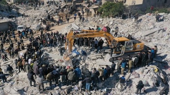 This aerial view shows rescuers searching for survivors amidst the rubble of a collapsed building in the town of Harim in Syria's rebel-held northwestern Idlib province on the border with Turkey, on February 8, 2023, two days after a deadly earthquake that hit Turkey and Syria.
Omar HAJ KADOUR / AFP
