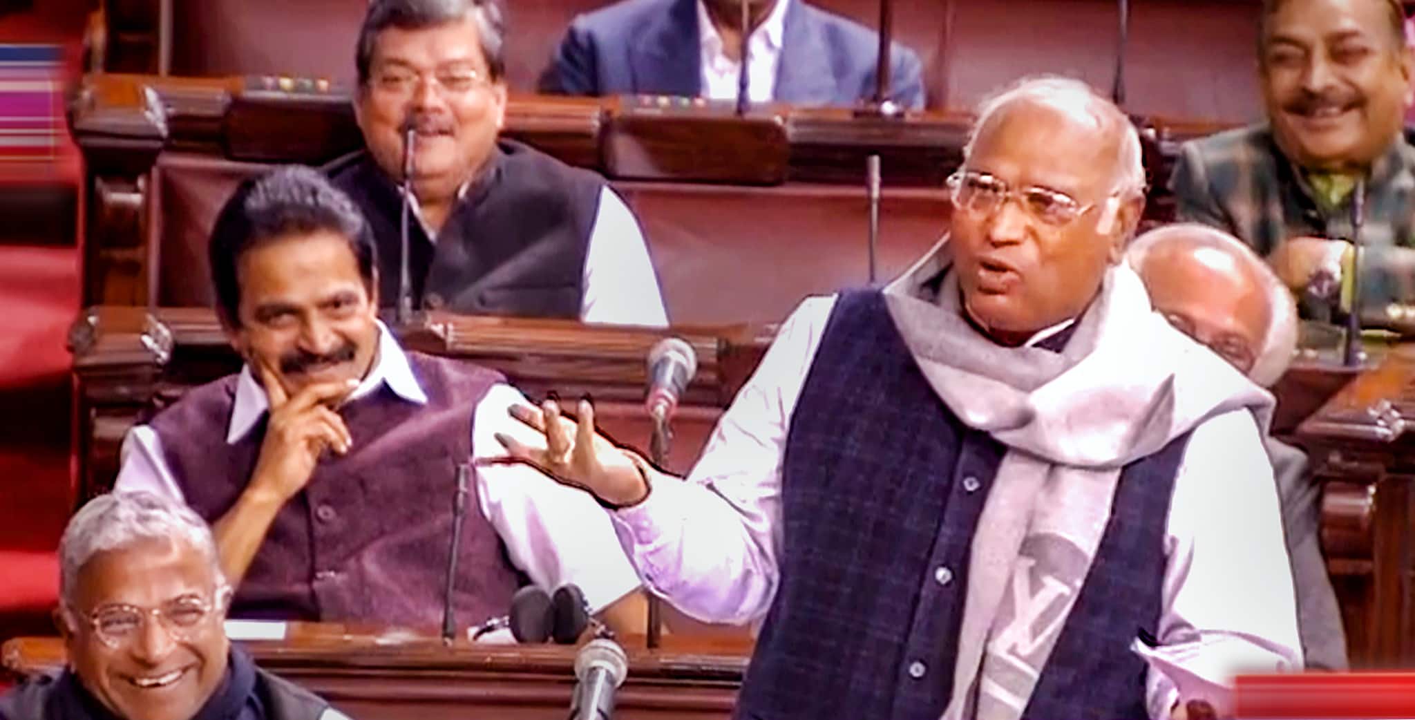 Chaos erupted in Rajya Sabha after Leader of Opposition Mallikarjun Kharge attacked BJP led Centre over its alleged links with Adani Group. Image: PTI