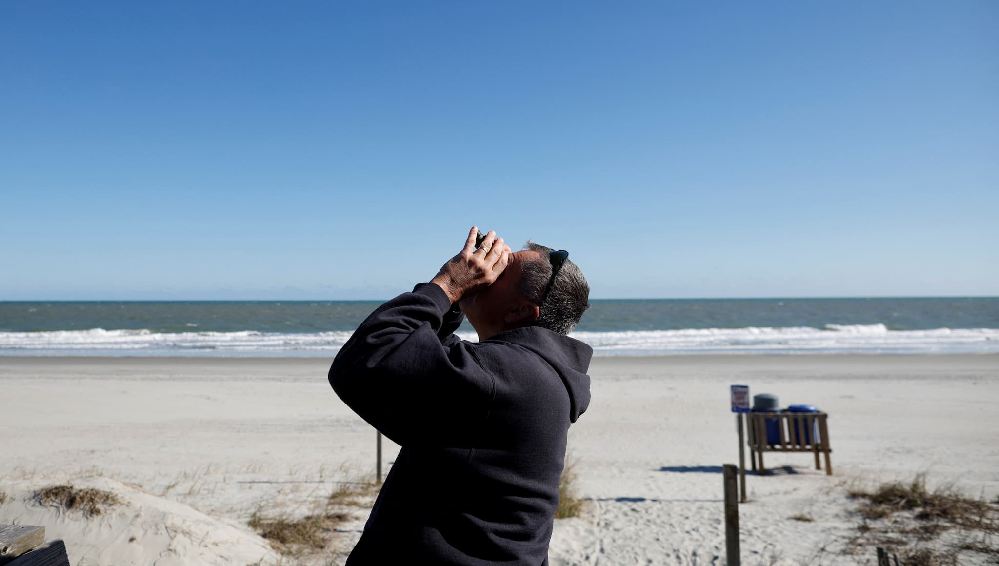 A man checks out a suspected Chinese spy balloon as it floats off the coast in Surfside Beach, South Carolina, U.S. February 4, 2023. The suspected spy balloon off the coast of South Carolina, in an area that didn't risk harming citizens with debris. (REUTERS/Randall Hill) A man checks out a suspected Chinese spy balloon as it floats off the coast in Surfside Beach, South Carolina, U.S. February 4, 2023. The suspected spy balloon off the coast of South Carolina, in an area that didn't risk harming citizens with debris. (REUTERS/Randall Hill)