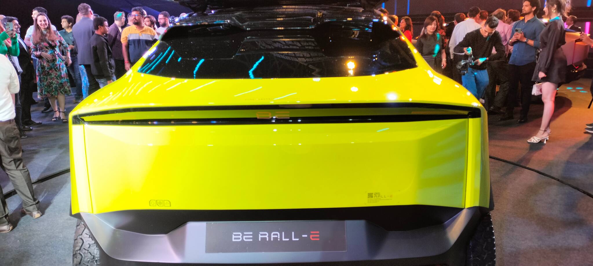 The bright fluorescent paintwork gives the Rall-E a rather trendy look, combined with multi-colored graphics. Lower down, the vehicle has a good off-roading bumper along with a skid plate. Furthermore, it has an orange tow hook as well as large auxiliary lights. These complete the look of the newly launched SUV. Image Credits: Avishek Banerjee The bright fluorescent paintwork gives the Rall-E a rather trendy look, combined with multi-colored graphics. Lower down, the vehicle has a good off-roading bumper along with a skid plate. Furthermore, it has an orange tow hook as well as large auxiliary lights. These complete the look of the newly launched SUV. Image Credits: Avishek Banerjee