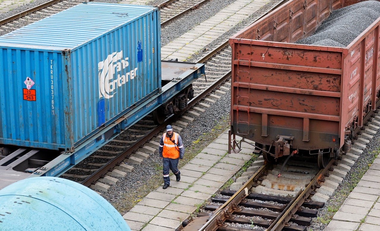 A railway employee walks near freight cars, following Lithuania's ban of the transit of goods under EU sanctions through the Russian exclave of Kaliningrad on the Baltic Sea, in June last year (Image: Reuters)