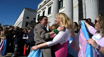 Spain's Minister for Equality Irene Montero (L) celebrates with LGTBI+ member Niurka Gibaja after women’s health reforms in the country. 