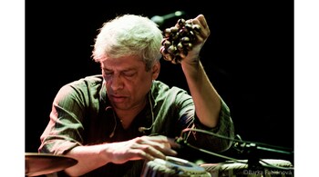 Trilok Gurtu’s elaborate “floor kit” features a drum set and the tabla, but also a bucket of water, cowbells, strings of ghungroos, gongs, cymbals and more. (Photo courtesy Trilok Gurtu)
