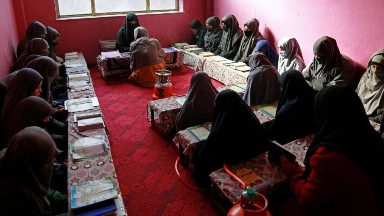 "We were depressed because we were denied an education," said 16-year-old Farah, a veil covering her face and hair. "It's then that my family decided I should at least come here. The only open place for us now is a madrassa." (Source: AFP)