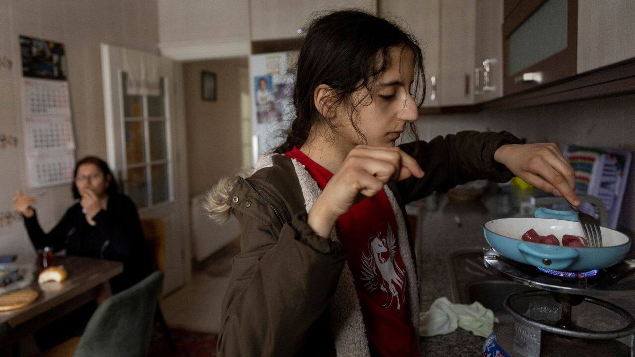 Nehir Karan, 13, cooks sausages while Sabriye Karan, 57, eats breakfast during a short visit to their damaged home following the recent deadly earthquake in Iskenderun, Turkey, February 25. The mother and daughter visit their apartment for a couple of hours every other day. They move through it with caution but shower, do the laundry and take some food. When they leave, Sabriye recites a prayer. &quot;I don't know if when I come back, it will still be standing or not,&quot; she said. (Source: Reuters)