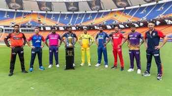 The captains of the respective IPL franchise pose in front of the trophy, at the Narendra Modi Stadium in Ahmedabad, they will be battling for over the course of two months. 