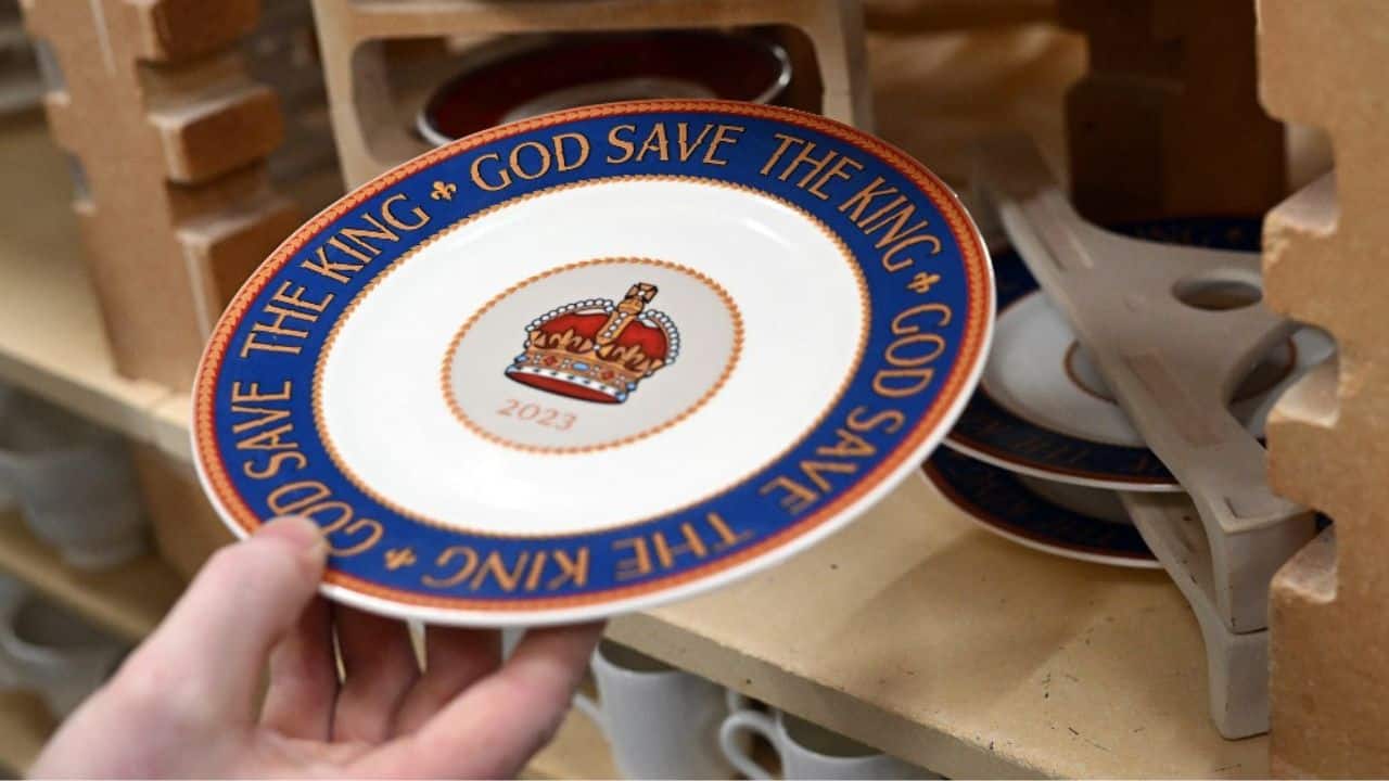 The bold red, white and blue design incorporates the Tudor crown of English monarchs from the time of Henry VIII with the words &quot;God Save The King&quot; in large gold letters. Prices range from £25 ($30) for a mug or £44.95 for a cup and saucer set. Produced using meticulous techniques honed over generations, each piece will go through the hands of over 20 craftspeople before it is finished. (Source: AFP)