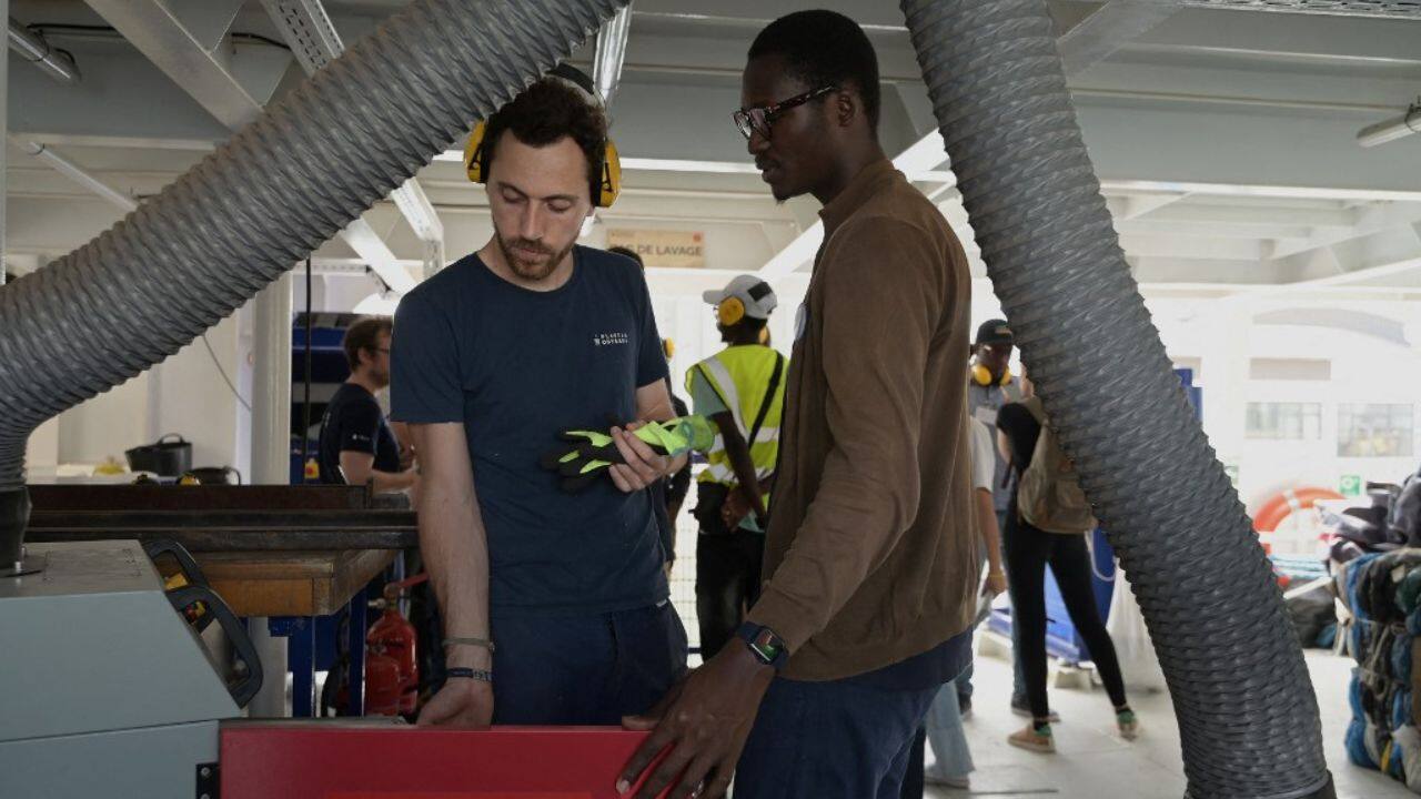 The Senegalese visitors were given a tour of the recycling process from start to finish -- from shredding and washing old plastic, drying it in a centrifuge and finally heating it to a molten state and extruding it, so that it can then be moulded into a new product. (Source: AFP)