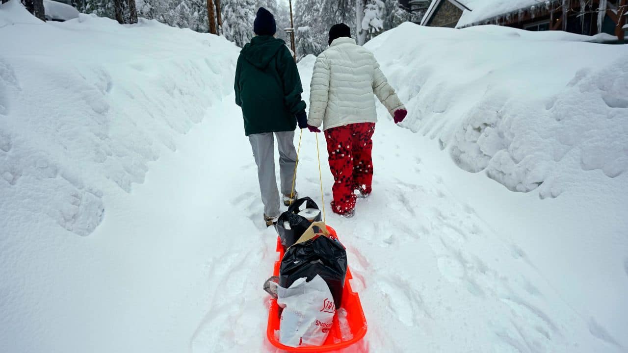 In the mountain town of Crestline, some people unable to drive trudged on foot to the grocery store. But Michael Johnstone said his family’s store was running low on February 28 on key inventory. “We’re completely out of bread. Milk is getting really light. We’re almost completely out of produce,” Johnstone said. Authorities escorted two full grocery trucks up to the mountain community, he said, but just in time for the new storm to add more snow. (Image: AP) In the mountain town of Crestline, some people unable to drive trudged on foot to the grocery store. But Michael Johnstone said his family’s store was running low on February 28 on key inventory. “We’re completely out of bread. Milk is getting really light. We’re almost completely out of produce,” Johnstone said. Authorities escorted two full grocery trucks up to the mountain community, he said, but just in time for the new storm to add more snow. (Image: AP)