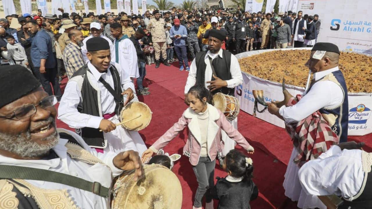 Ali Messaoud al-Ftimi, who organised the giant couscous, said he hosts similar events each year at different historical sites to send "a message to parliament" that Libya should have its couscous recognised too. Ftimi, who heads an association aiming to encourage tourism and preserve Libya's heritage, told AFP the efforts come from "a popular impulse" and he hopes lawmakers will ratify the international UN convention "in the near future". "Adhering to this convention will not only preserve couscous," the 54-year-old said. "Libya is rich in culture and heritage and this heritage is not protected". (Source: AFP) Ali Messaoud al-Ftimi, who organised the giant couscous, said he hosts similar events each year at different historical sites to send "a message to parliament" that Libya should have its couscous recognised too. Ftimi, who heads an association aiming to encourage tourism and preserve Libya's heritage, told AFP the efforts come from "a popular impulse" and he hopes lawmakers will ratify the international UN convention "in the near future". "Adhering to this convention will not only preserve couscous," the 54-year-old said. "Libya is rich in culture and heritage and this heritage is not protected". (Source: AFP)