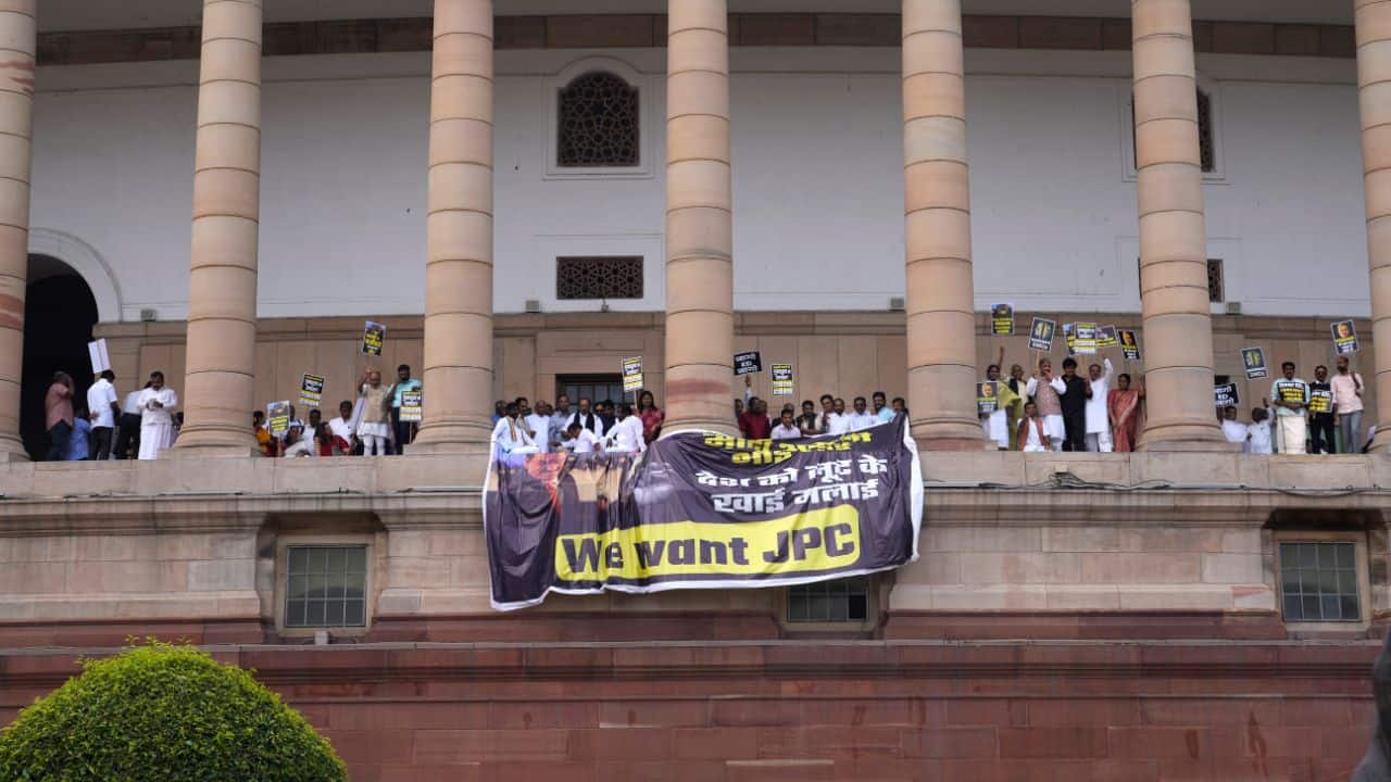 TMC MPs held a separate protest in Parliament complex and demanded that Prime Minister Narendra Modi break his silence on the Adani issue. (Image: AP) TMC MPs held a separate protest in Parliament complex and demanded that Prime Minister Narendra Modi break his silence on the Adani issue. (Image: AP)