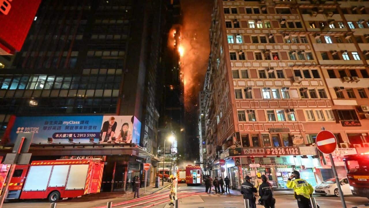 Flames were first spotted near scaffolding at the top of the building on March 2 night, with the blaze clearly visible across the harbour and sending sparks raining down on to neighbouring streets. Around an hour later, the fire had spread down the length of the building and was approaching street level, where hundreds of onlookers had gathered. Japanese tourist Tosho Sai, who was staying in a nearby building, said a security guard told everyone on his floor to leave after a window in the unit next door was hit by embers. (Source: AFP)