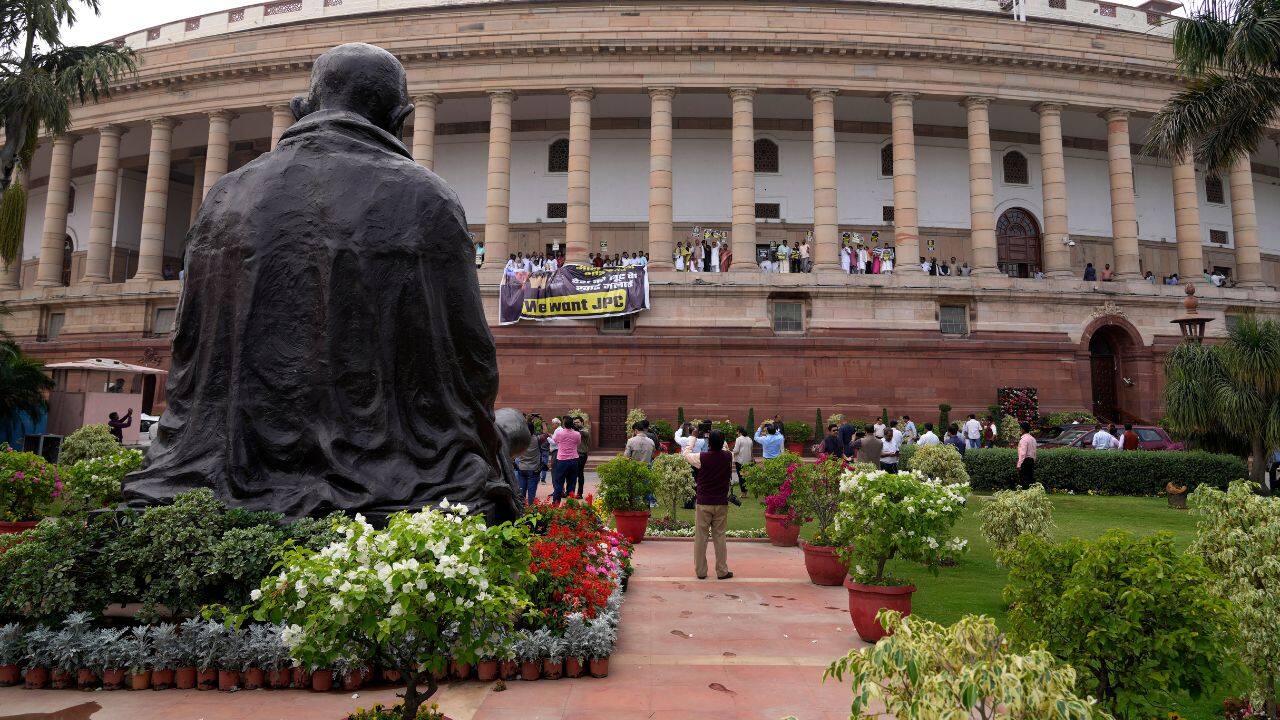 Both Houses of Parliament were adjourned till 2 pm on March 21 amid uproar over the Adani issue and demand by ruling party members that Rahul Gandhi apologies for his democracy remarks. (Image: AP) Both Houses of Parliament were adjourned till 2 pm on March 21 amid uproar over the Adani issue and demand by ruling party members that Rahul Gandhi apologies for his democracy remarks. (Image: AP)