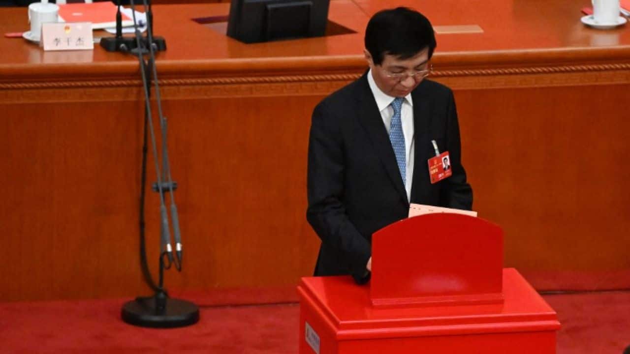 On March 10, delegates handed Xi a third term as president and re-appointed him head of the country's Central Military Commission in a unanimous vote. Beijing's Great Hall of the People, a cavernous state building on the edge of Tiananmen Square, was adorned with crimson carpets and banners for the landmark vote, with a military band providing background music. (Source: AFP)