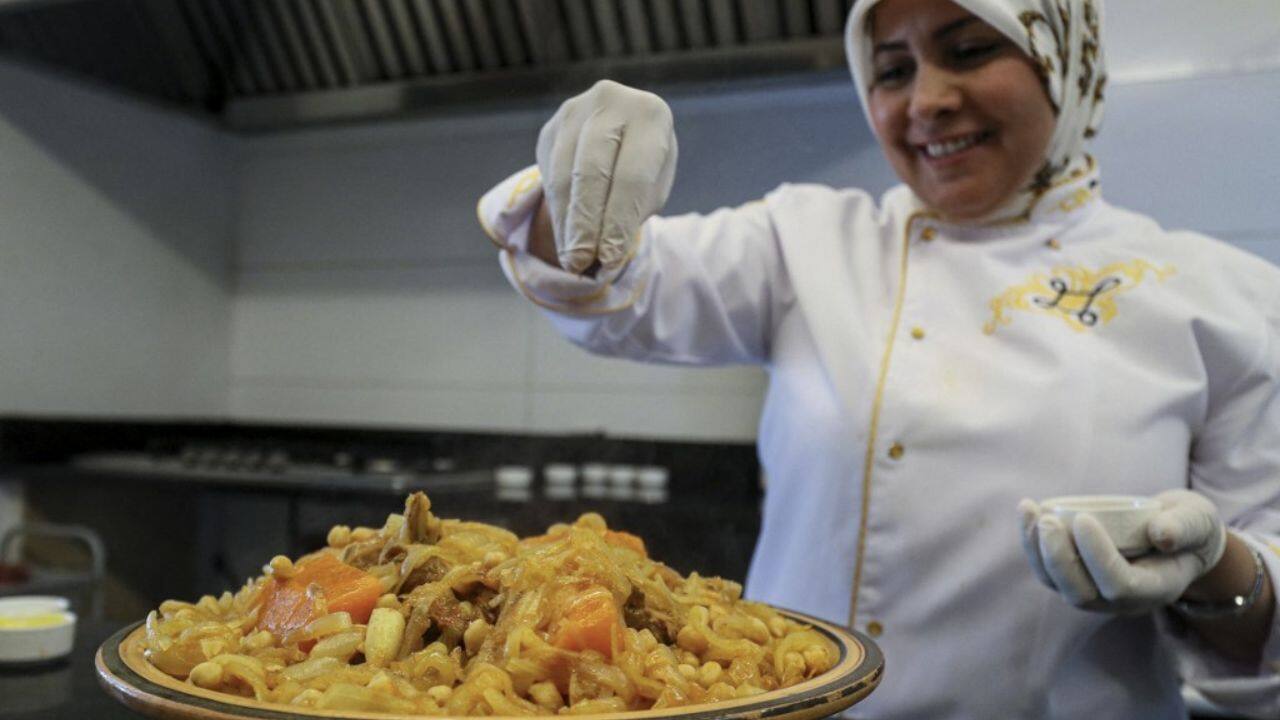 Wearing a white chef's uniform embroidered with golden trim, she prepares couscous as her mother taught her -- with a pinch of salt, a little chilli powder and a touch of cinnamon for a sweet aftertaste. "Couscous is not just a dish that we eat," Zwait said. "It is the mirror of a civilisation and a knowledge transmitted from generation to generation". (Source: AFP) Wearing a white chef's uniform embroidered with golden trim, she prepares couscous as her mother taught her -- with a pinch of salt, a little chilli powder and a touch of cinnamon for a sweet aftertaste. "Couscous is not just a dish that we eat," Zwait said. "It is the mirror of a civilisation and a knowledge transmitted from generation to generation". (Source: AFP)