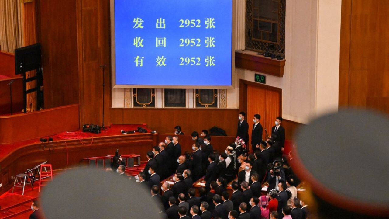 A digital monitor on the edge of the stage proclaimed the final tally -- all 2,952 votes had been cast in favour of giving Xi another term in office. The announcement was followed by delegates' fervent declarations of allegiance to the Chinese constitution, in a demonstration of loyalty and unanimity. (Source: AFP)