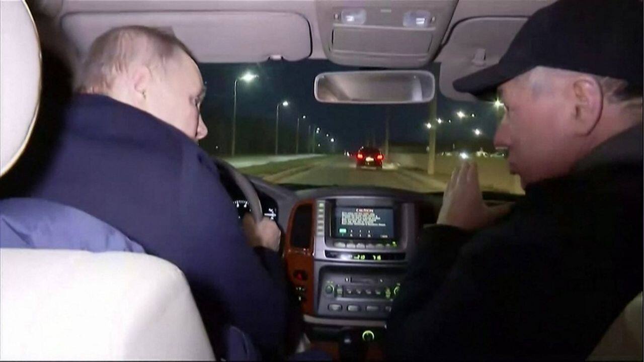 The Russian leader took a tour of the city and was seen driving a car. The Kremlin said he visited a rebuilt musical theatre and followed the presentation of a report on reconstruction work. (Source: AFP)