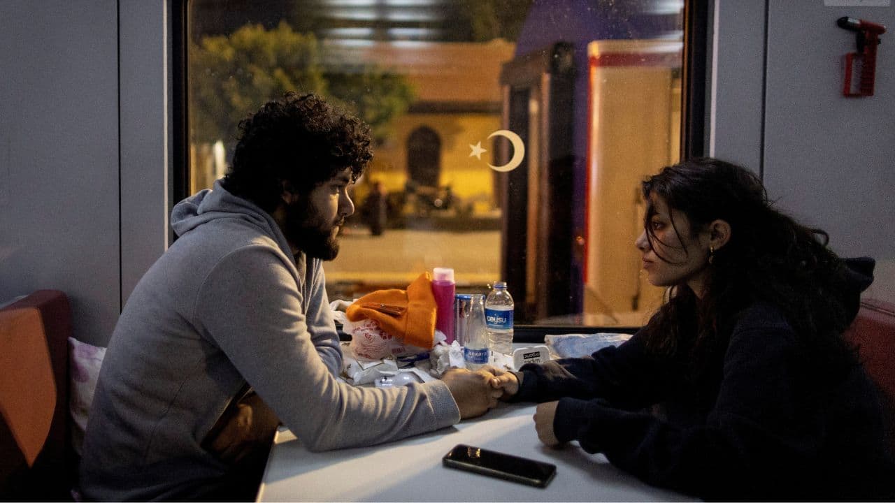 Yusuf Kurma, 20, and Aysel Ozcelik, 20, sit holding hands in one of the carriages at Iskenderun train station, as they talk about their upcoming marriage, in Iskenderun, Turkey, February 18. The couple, who planned to marry, ran to find each other after the first shock. Now they might postpone the wedding. &quot;We can't have a wedding when we have so many dead,&quot; Ozcelik said. (Source: Reuters)