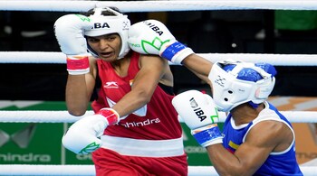 Jaismine in (Red) and Paola Valdez of Colombia during their 60kg category quarterfinals bout at the 2023 IBA Women's Boxing World Championships, in New Delhi on March 22, 2023. (PTI Photo)