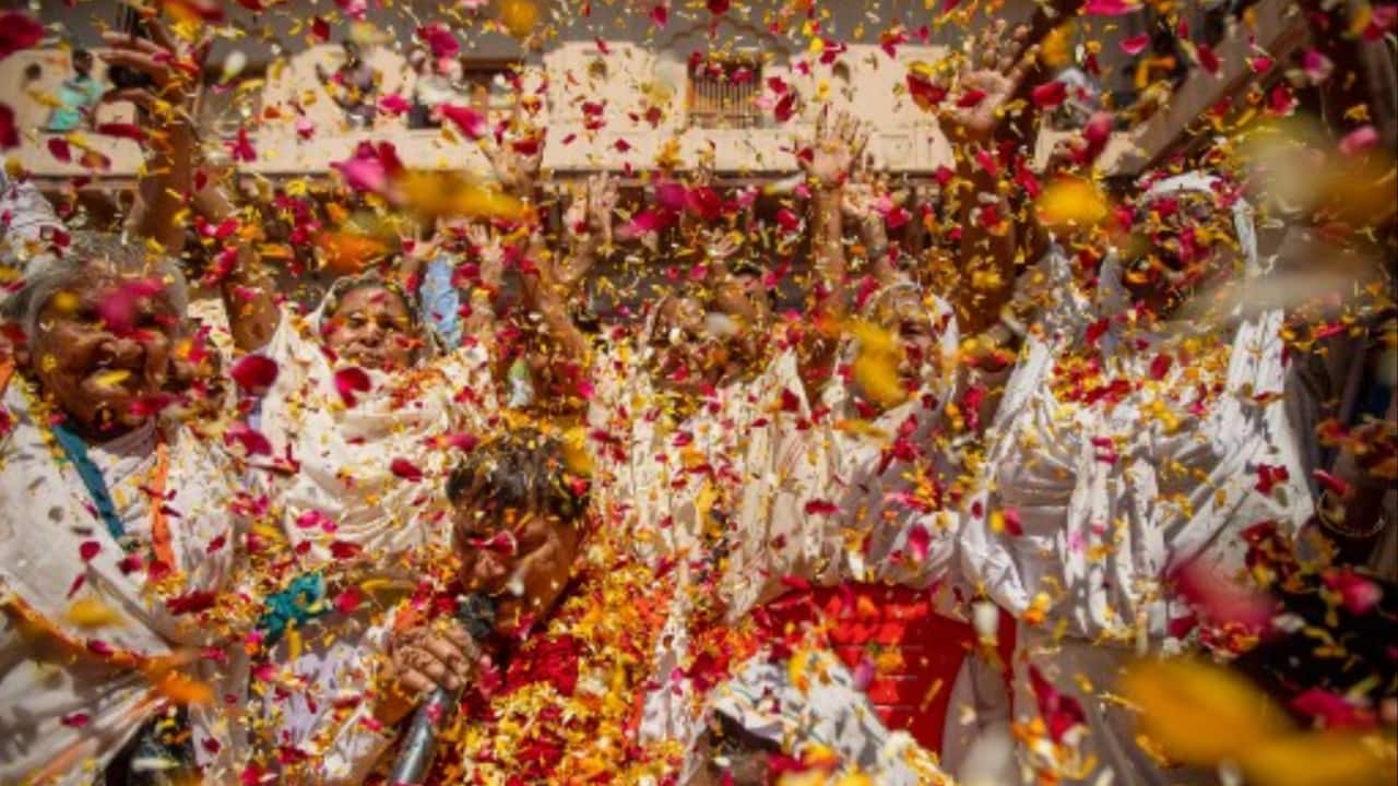 Widows shower flower petals as they celebrate Holi, the Hindu spring festival of colours at a temple, in Vrindavan.