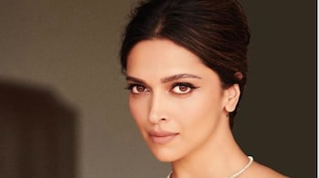 Deepika Padukone chose a black Louis Vuitton gown and Cartier necklace to channel old Hollywood glamour.