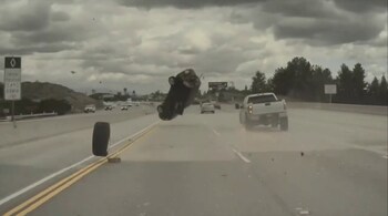 A rogue tyre sent a car flipping on an LA highway (Image: Anoop_Khatra/Twitter)