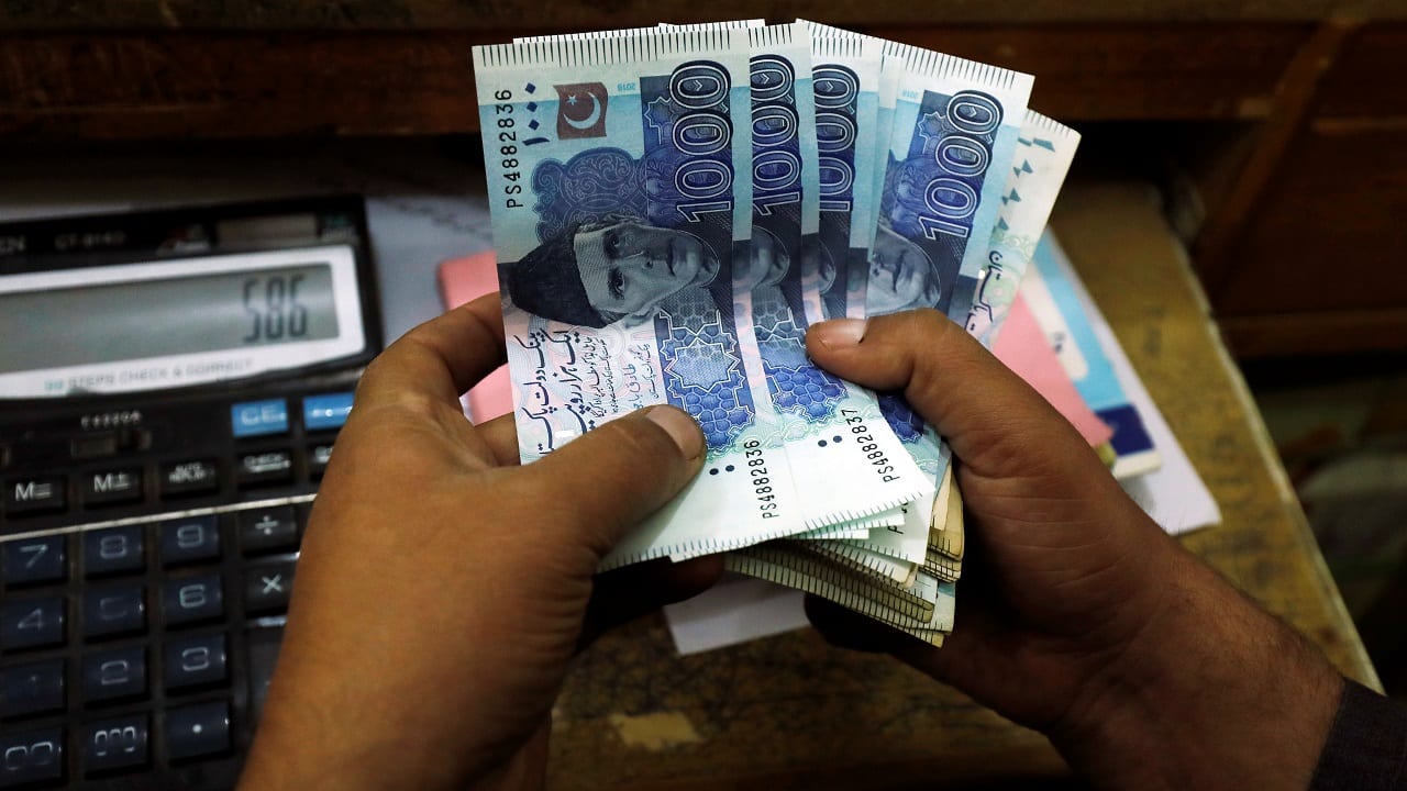 Pakistan rupee tumbles to record $300 as military to quell unrest