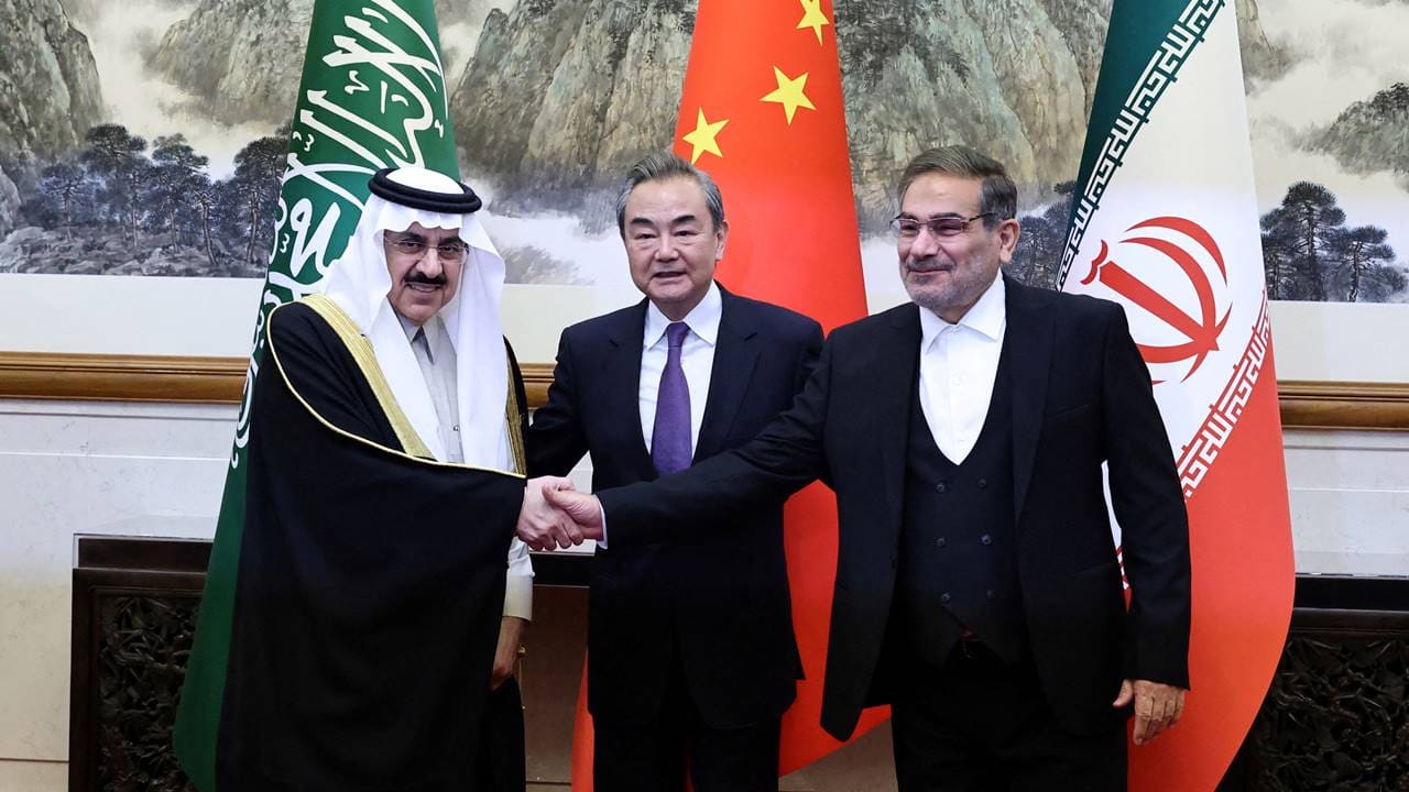 Wang Yi (centre), a member of the Political Bureau of the Communist Party of China (CPC) Central Committee and director of the Office of the Central Foreign Affairs Commission, Ali Shamkhani, (right) the secretary of Iran’s Supreme National Security Council, and Minister of State and national security adviser of Saudi Arabia Musaad bin Mohammed Al Aiban (left) pose for pictures during a meeting in Beijing, China, on March 10, 2023. (Image: Reuters)
