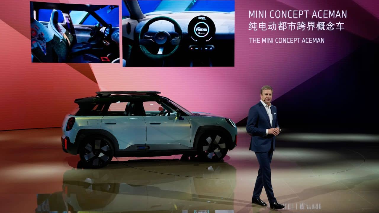 Oliver Zipse, chairman of the Board of Management of BMW AG, speaks as he unveils the new Mini Concept Aceman during the press day of the Auto Shanghai 2023 at the National Exhibition and Convention Center in Shanghai, China. (Image: AP)
