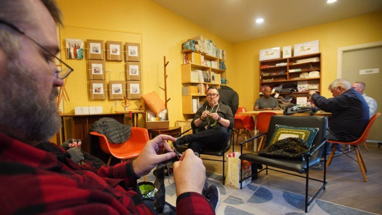 The group's coordinator Gene Throwe says he hopes to "provide a safe space for men to knit together and trade our skills with one another, to help each other out, because knitting has for quite a while been viewed as a female vocation." The 51-year-old Throwe, an office manager for a national association of nursing schools, puts some finishing touches on a brown sweater with a subtle golden pattern that he's been making on and off for years. (Source: AFP) The group's coordinator Gene Throwe says he hopes to "provide a safe space for men to knit together and trade our skills with one another, to help each other out, because knitting has for quite a while been viewed as a female vocation." The 51-year-old Throwe, an office manager for a national association of nursing schools, puts some finishing touches on a brown sweater with a subtle golden pattern that he's been making on and off for years. (Source: AFP)