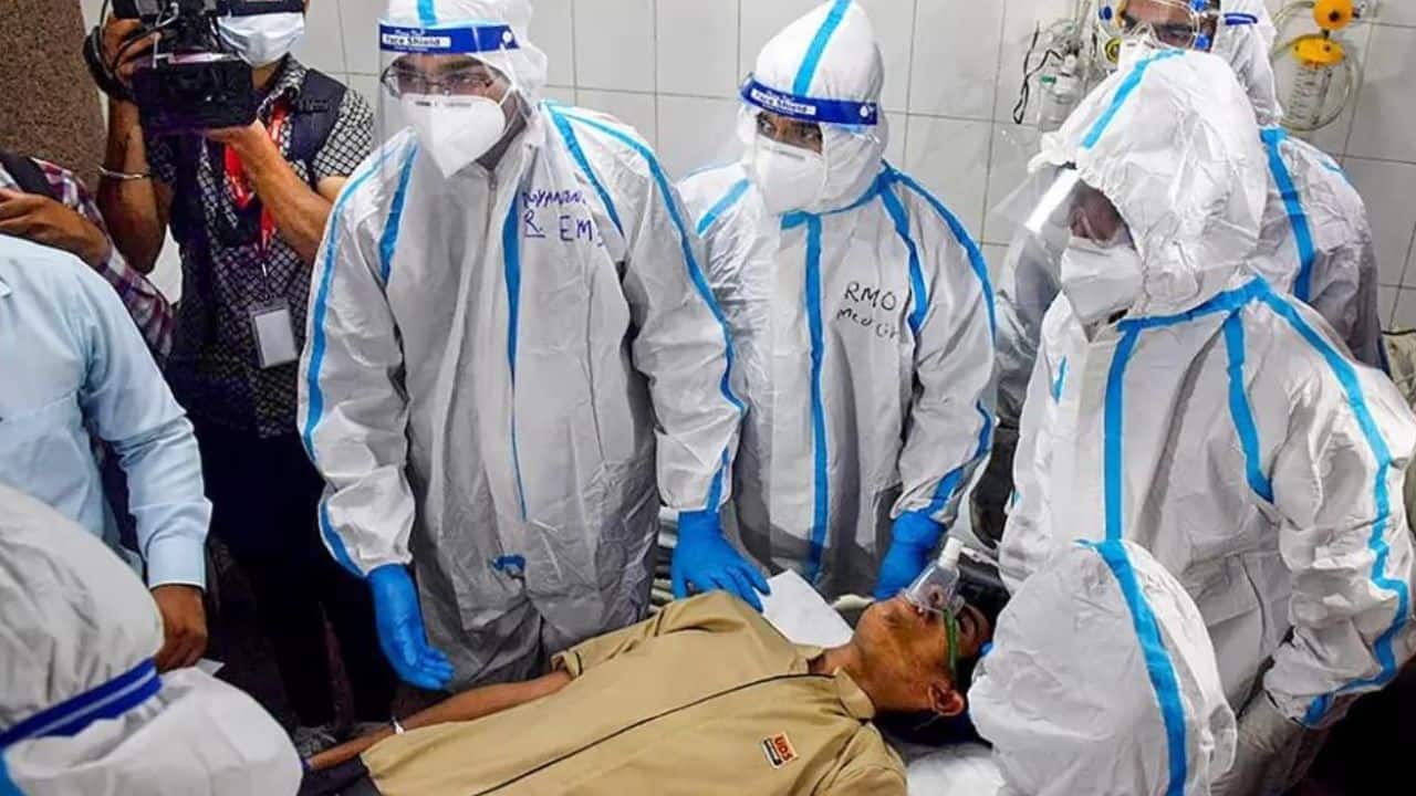 Healthcare workers take part in a mock drill to check COVID-19 preparedness amid rising cases of coronavirus, at Hamidia Hospital, in Bhopal. (Image: PTI)