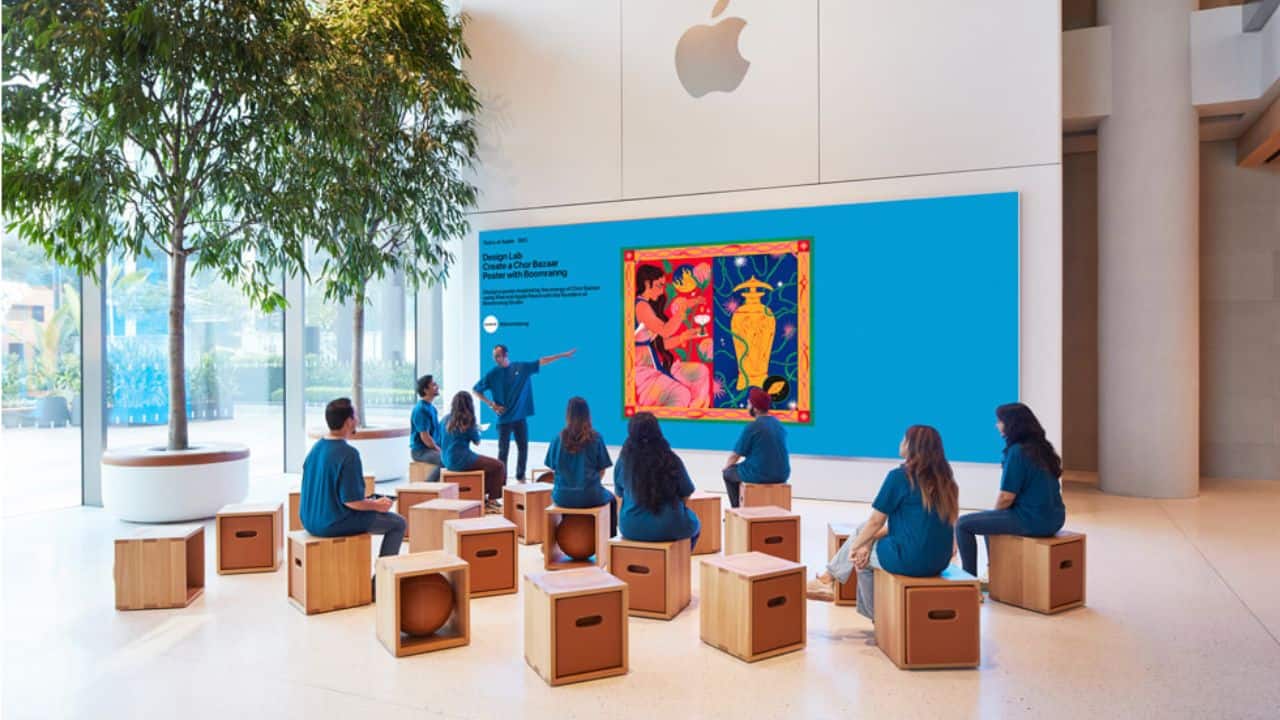 Upon entering the store, customers are greeted by two stone walls sourced from Rajasthan and a 14-meter-long stainless steel staircase connecting the ground level and the cantilevered mezzanine. (Image: Apple)